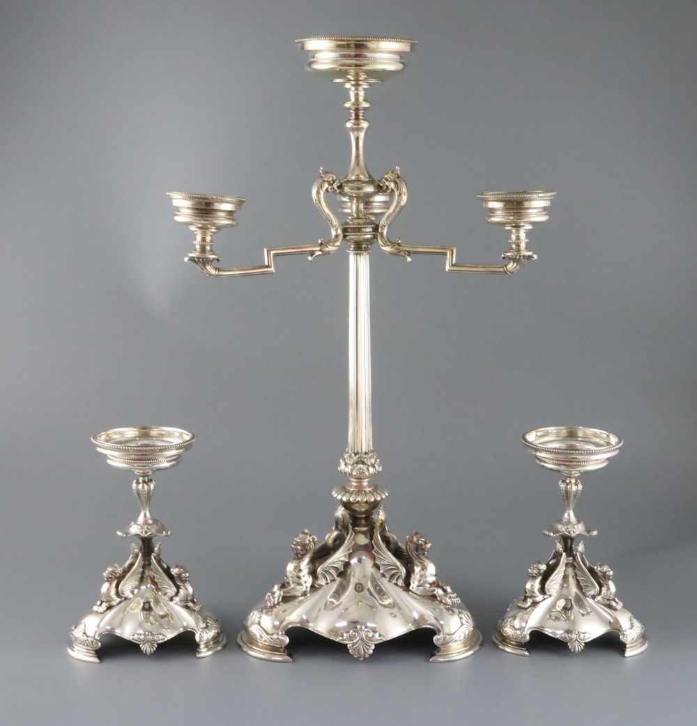 A Victorian electroplated three-piece table garniture by Elkington & Co. (lacking glass bowls), tallest 22.25in.